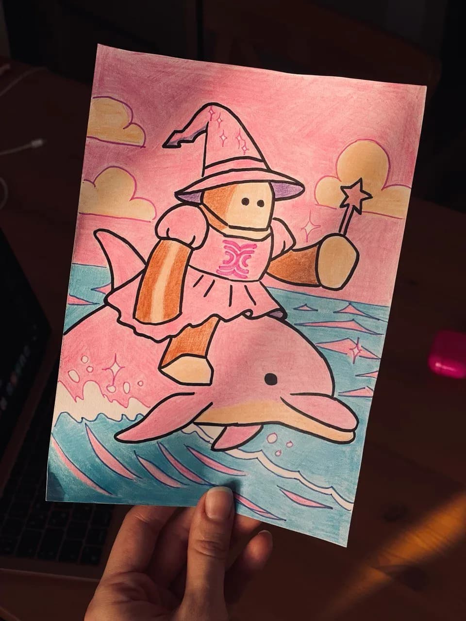 Rocky the fairy on a pink dolphin
